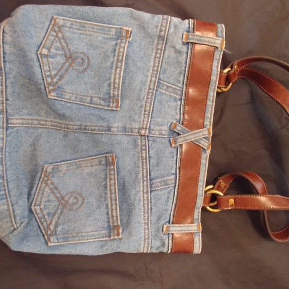 This is a jean bag with five pockets and brown han - Picture 3 of 3